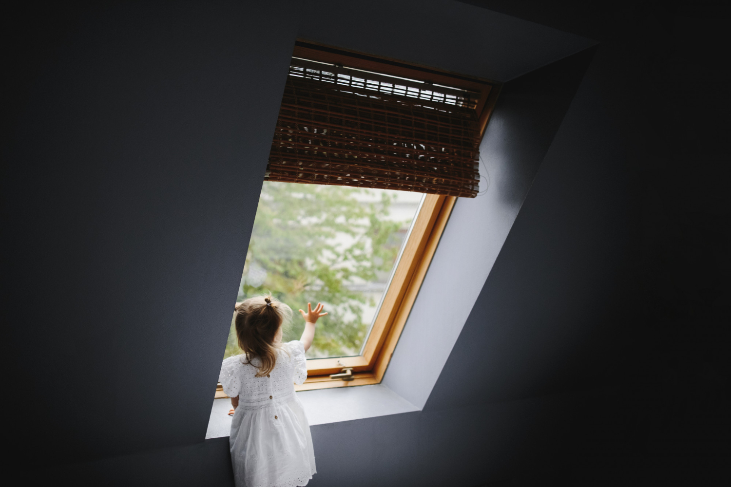 little-girl-looks-something-window